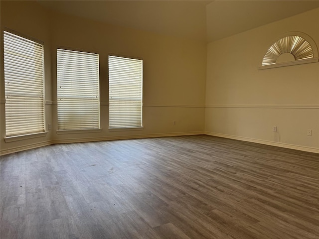 empty room with dark hardwood / wood-style floors