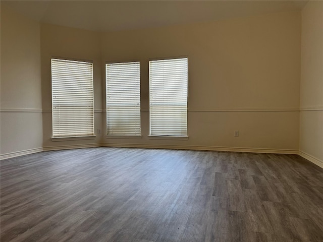 unfurnished room featuring dark hardwood / wood-style floors