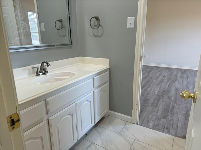 bathroom featuring vanity and wood-type flooring