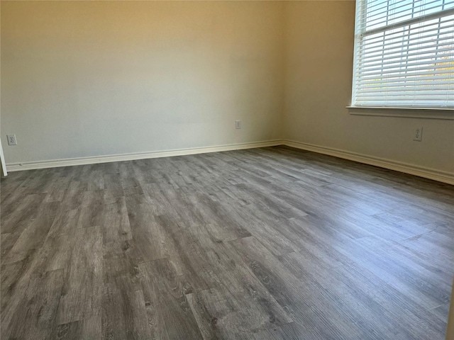 empty room featuring dark wood-type flooring