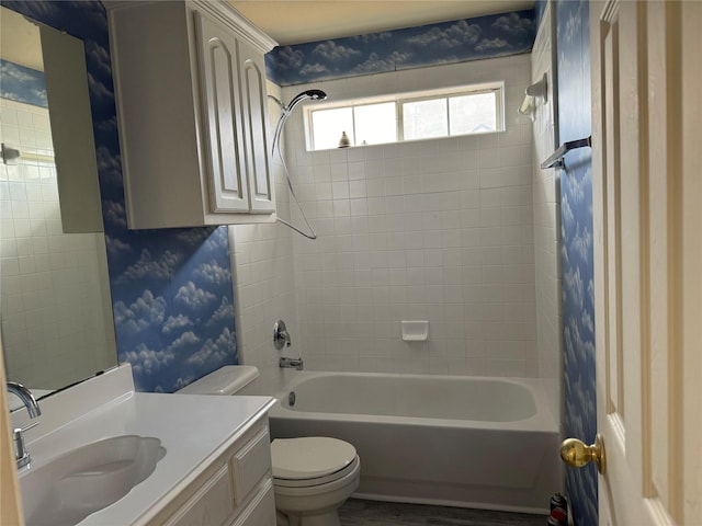 full bathroom with vanity, toilet, and tiled shower / bath