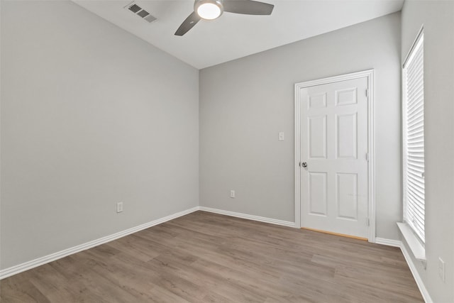 unfurnished room featuring light hardwood / wood-style floors and ceiling fan