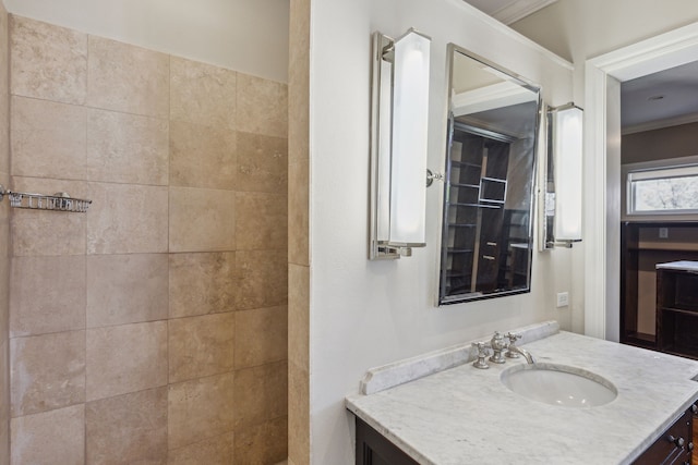 bathroom with vanity and ornamental molding