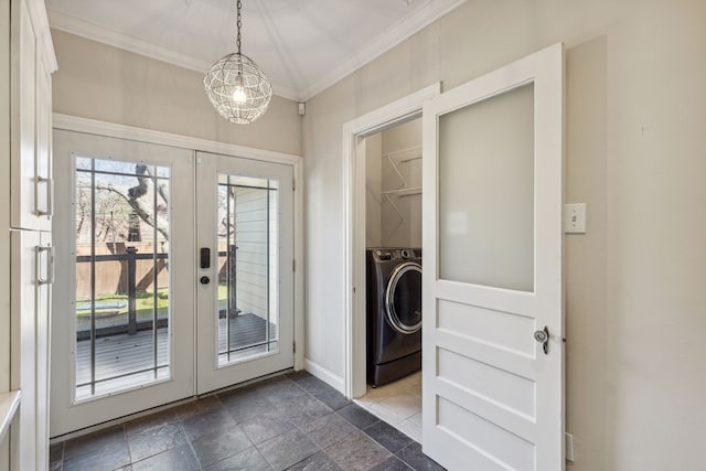 clothes washing area with a chandelier, crown molding, washer / clothes dryer, and french doors