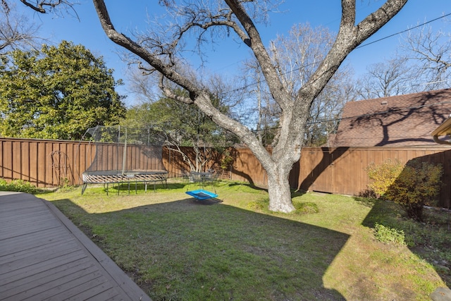 view of yard with a trampoline