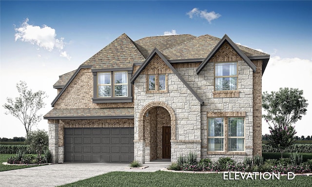 english style home with a front lawn and a garage