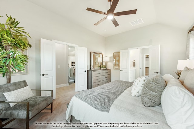 bedroom featuring ceiling fan, light colored carpet, and lofted ceiling