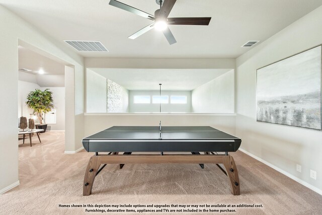 recreation room featuring ceiling fan and light colored carpet