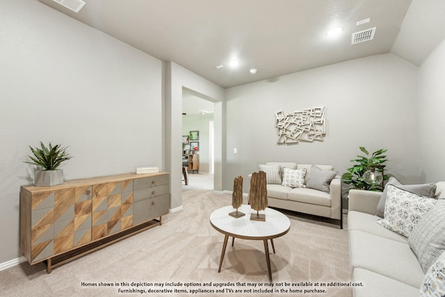 living room featuring lofted ceiling and carpet floors