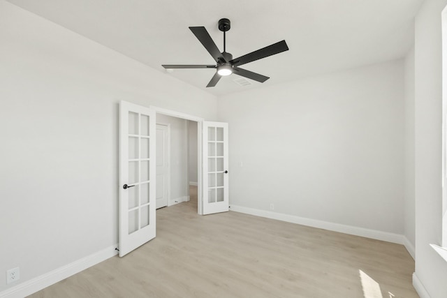 unfurnished bedroom featuring french doors, baseboards, light wood-type flooring, and visible vents
