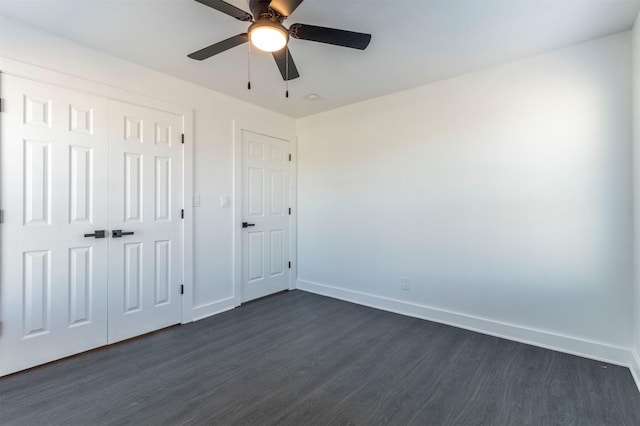 unfurnished bedroom with a closet, ceiling fan, and dark hardwood / wood-style flooring