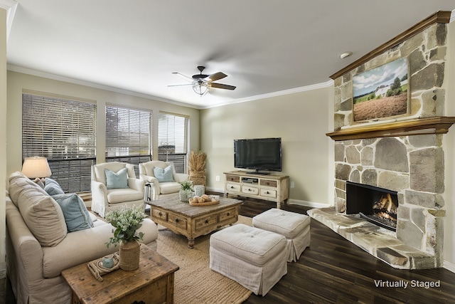 living room featuring ceiling fan, a fireplace, ornamental molding, and hardwood / wood-style flooring