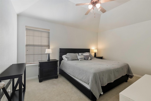 bedroom with ceiling fan, light carpet, and vaulted ceiling