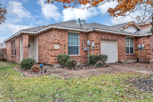 view of home's exterior with a garage and a yard