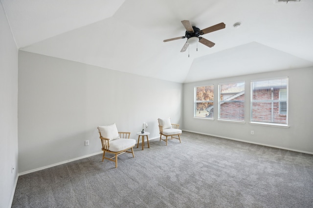 unfurnished room with dark colored carpet, lofted ceiling, and ceiling fan