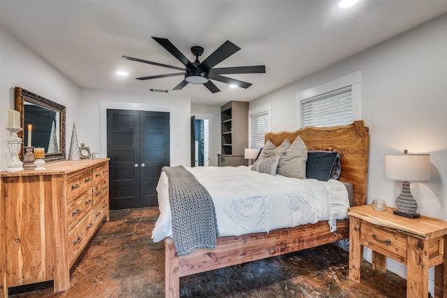 bedroom with ceiling fan and a closet