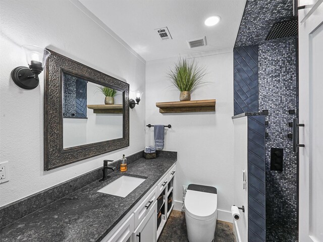 6596 Wells Burnett Rd, Fort Worth, TX 76135 - bathroom with toilet, crown molding, vanity, a tile shower, and baseboards