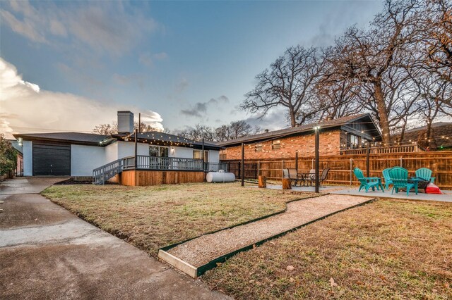 6596 Wells Burnett Rd, Fort Worth, TX 76135 - back of house featuring a chimney, brick siding, and a patio area