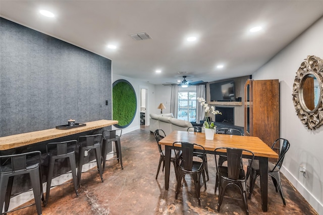 dining space featuring ceiling fan