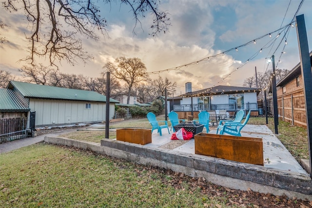 6596 Wells Burnett Rd, Fort Worth, TX 76135 - yard at dusk with a fire pit