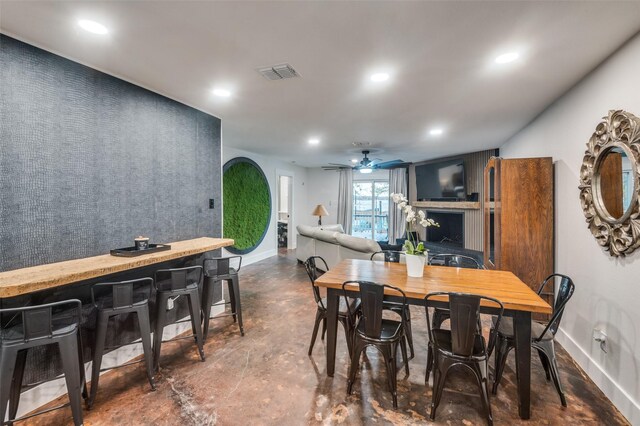 6596 Wells Burnett Rd, Fort Worth, TX 76135 - dining space with recessed lighting, baseboards, a ceiling fan, and concrete flooring