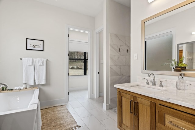 bathroom featuring tile patterned flooring, vanity, and a bath