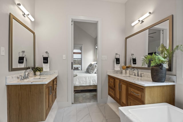 bathroom featuring vanity and vaulted ceiling