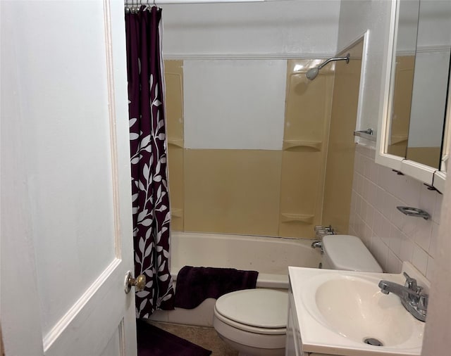 full bathroom with vanity, tile walls, shower / bathtub combination with curtain, and toilet