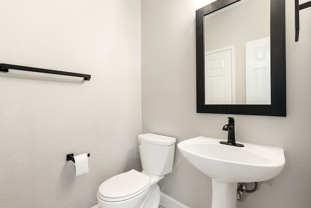 bathroom with sink and toilet