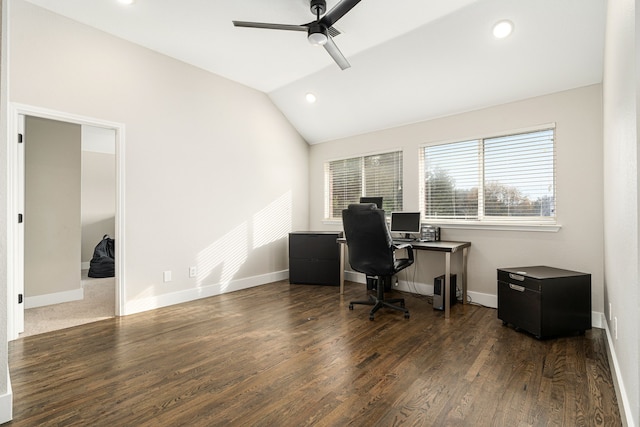 home office featuring dark hardwood / wood-style floors, vaulted ceiling, and ceiling fan