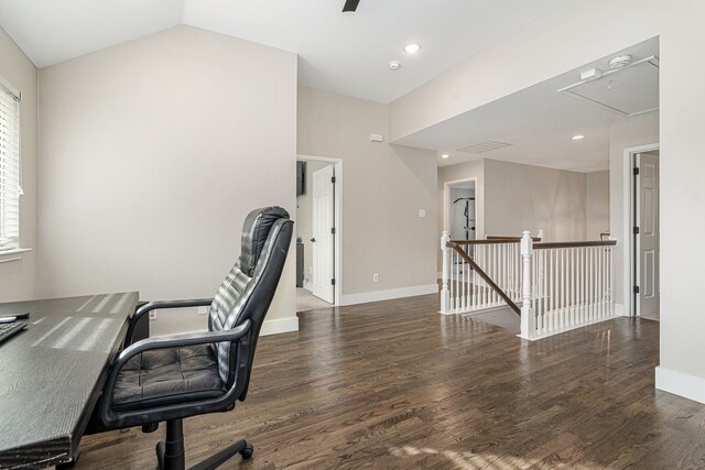 bedroom featuring ceiling fan, connected bathroom, light carpet, and vaulted ceiling