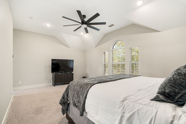 bedroom featuring lofted ceiling, light carpet, and ceiling fan