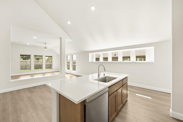 121 Red Cedar Ct, Balch Springs, TX 75181 - kitchen featuring dishwasher, a sink, baseboards, open floor plan, and light wood-style floors
