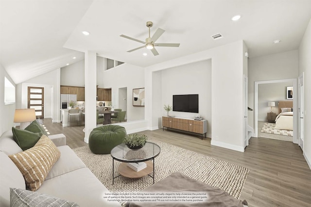 121 Red Cedar Ct, Balch Springs, TX 75181 - living room featuring a ceiling fan, vaulted ceiling, light wood-style floors, recessed lighting, and baseboards