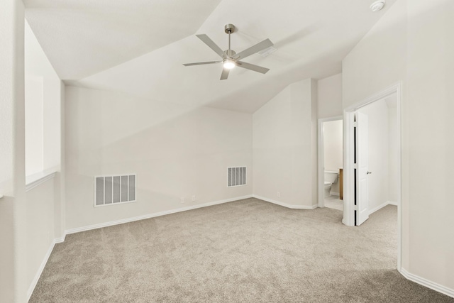bonus room featuring visible vents, carpet floors, and lofted ceiling