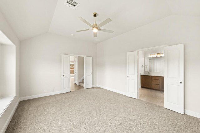 121 Red Cedar Ct, Balch Springs, TX 75181 - unfurnished bedroom with vaulted ceiling, light carpet, baseboards, connected bathroom, and a ceiling fan