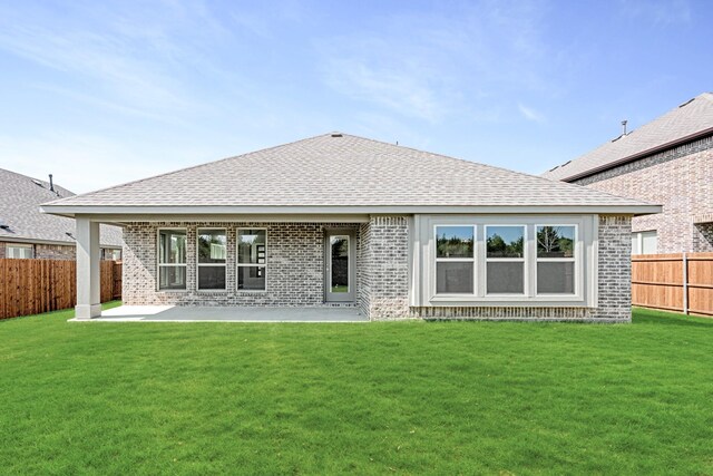 121 Red Cedar Ct, Balch Springs, TX 75181 - back of house featuring brick siding, roof with shingles, and a patio area