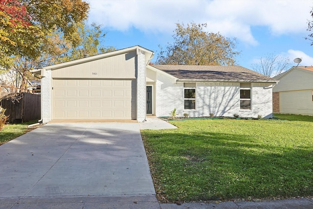 ranch-style house with a front lawn and a garage