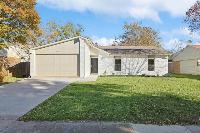 view of front facade featuring a garage and a front lawn