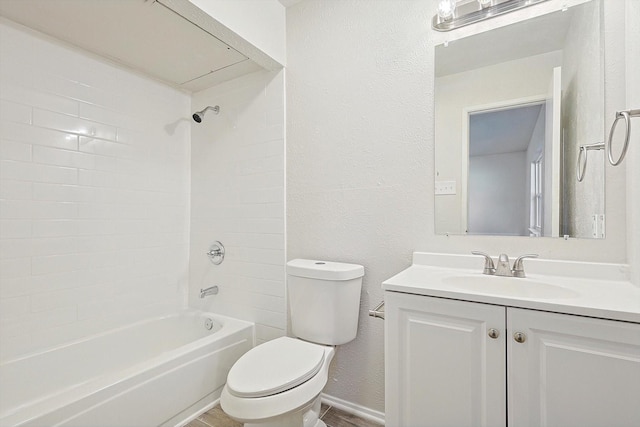 full bathroom with vanity, toilet, and tiled shower / bath