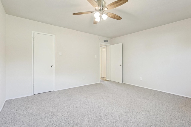 empty room featuring carpet and ceiling fan