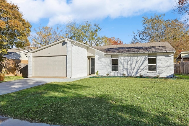 ranch-style house with a garage and a front lawn