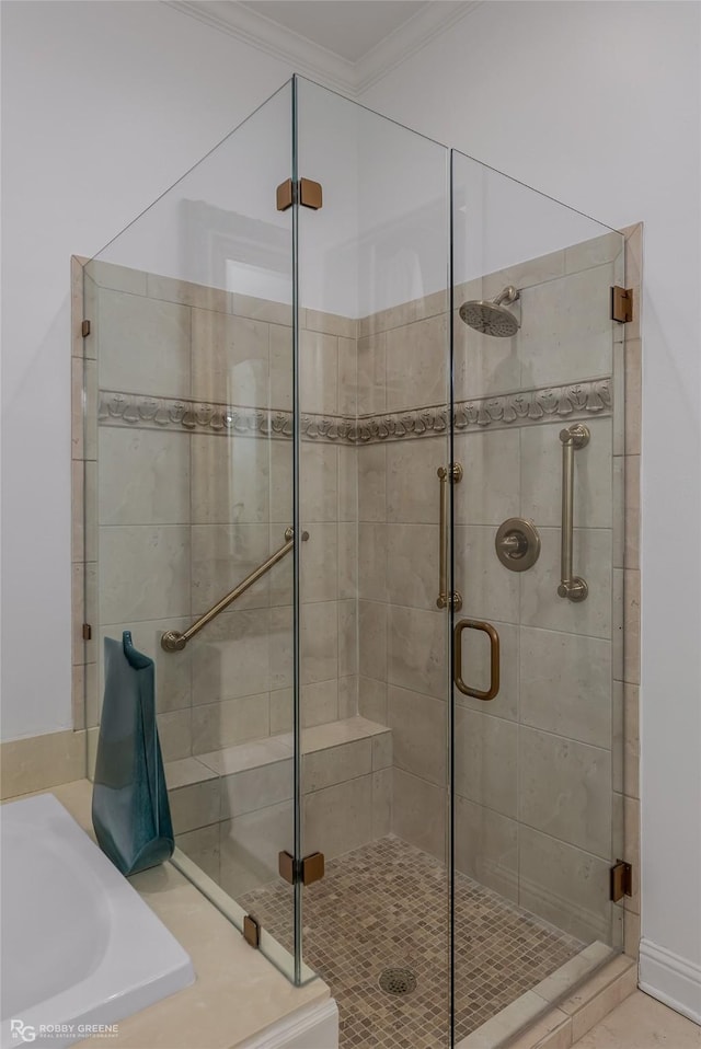 bathroom featuring crown molding, independent shower and bath, and sink