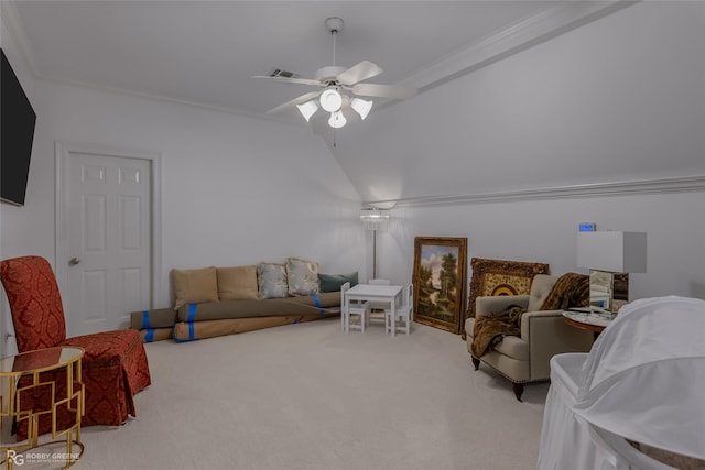 living room featuring vaulted ceiling, ceiling fan, ornamental molding, and carpet floors