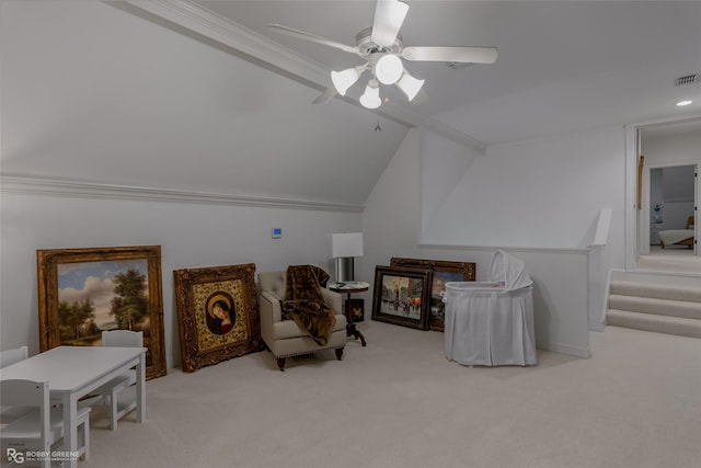 living area featuring crown molding, vaulted ceiling, light carpet, and ceiling fan