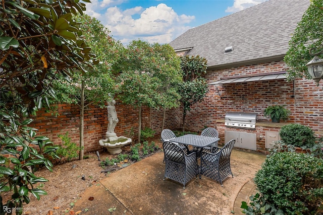 view of patio featuring area for grilling and grilling area