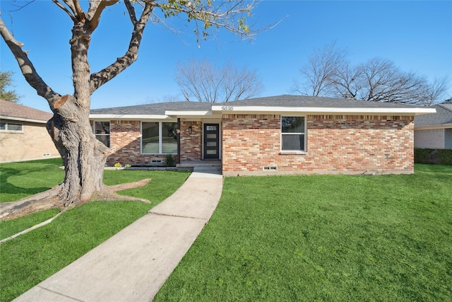 ranch-style home with a front lawn