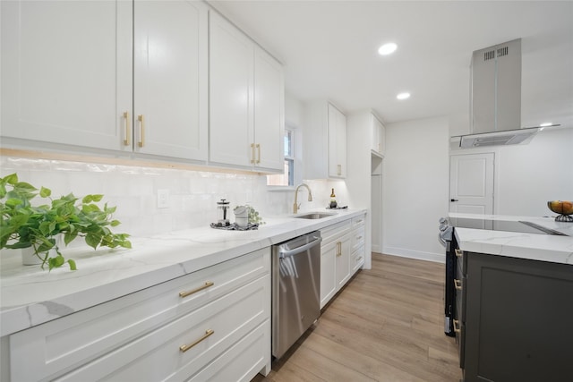 kitchen featuring wall chimney exhaust hood, tasteful backsplash, stainless steel dishwasher, light hardwood / wood-style floors, and white cabinets