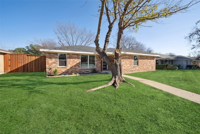 ranch-style home with a front yard