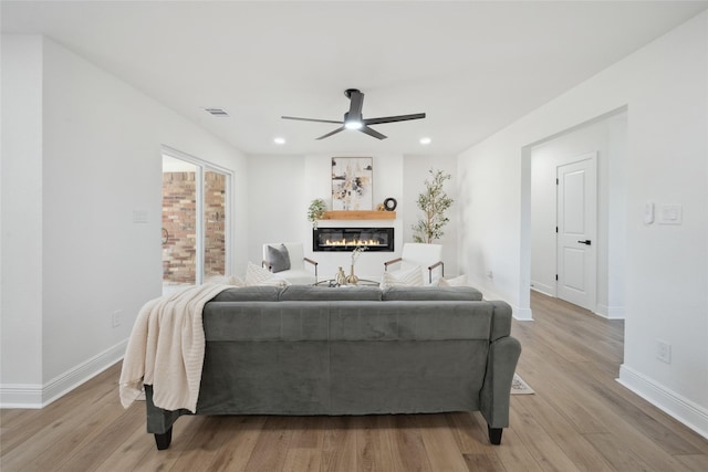 bedroom featuring ceiling fan and light hardwood / wood-style flooring